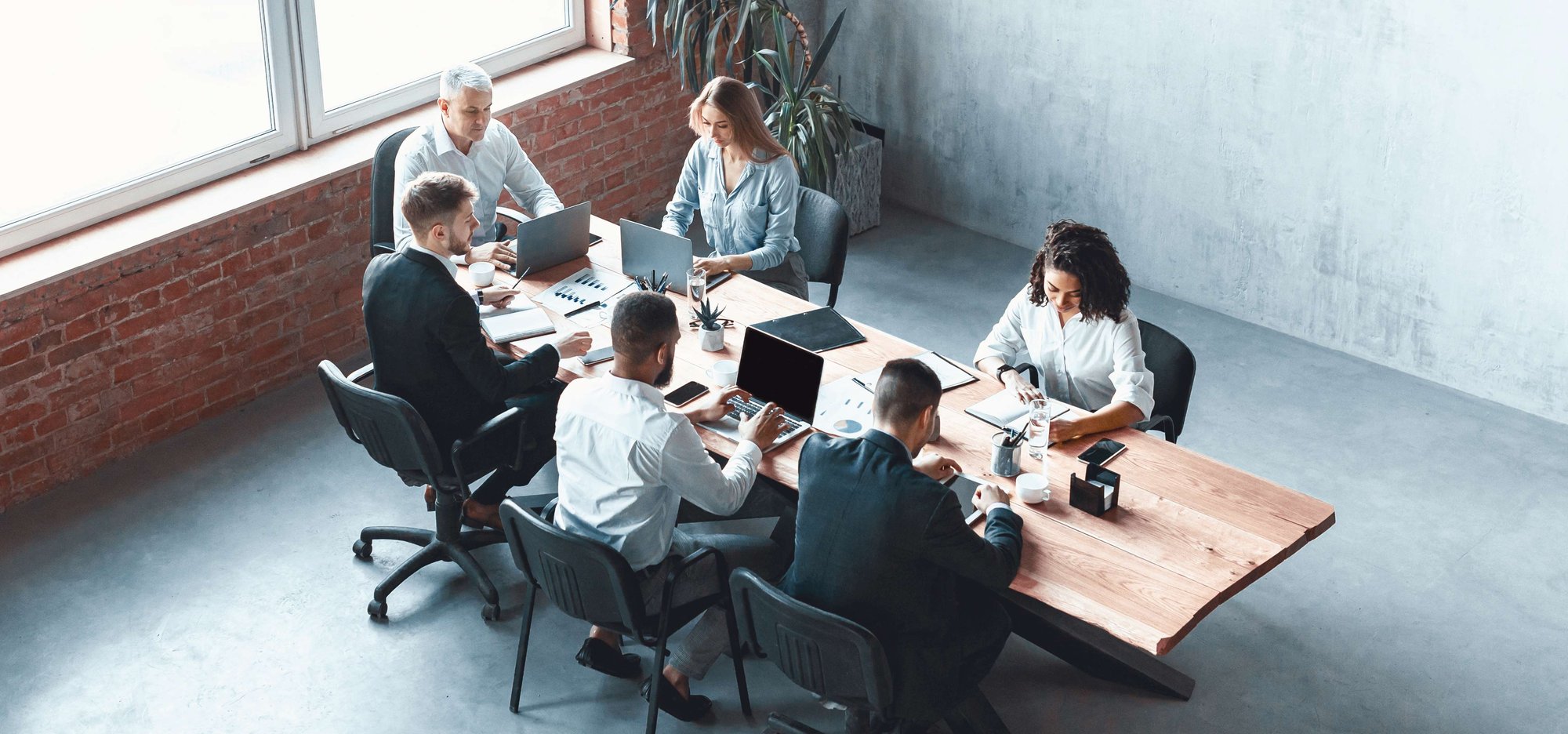 multiethnic-business-team-working-together-sitting-1